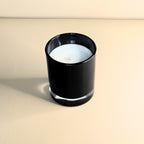 Minimalist white soy candle in glossy black glass – Wicks of Intention.